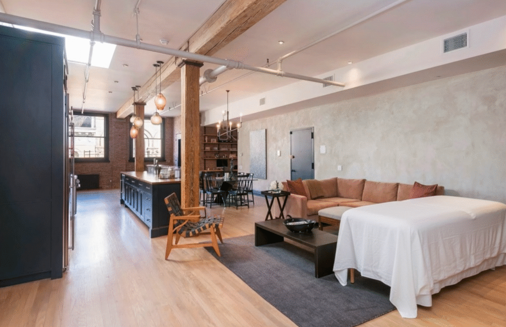 Luxury loft apartment in Tribeca NYC prepared for Knead NYC in-home mobile massage setup with massage table and modern interior design.