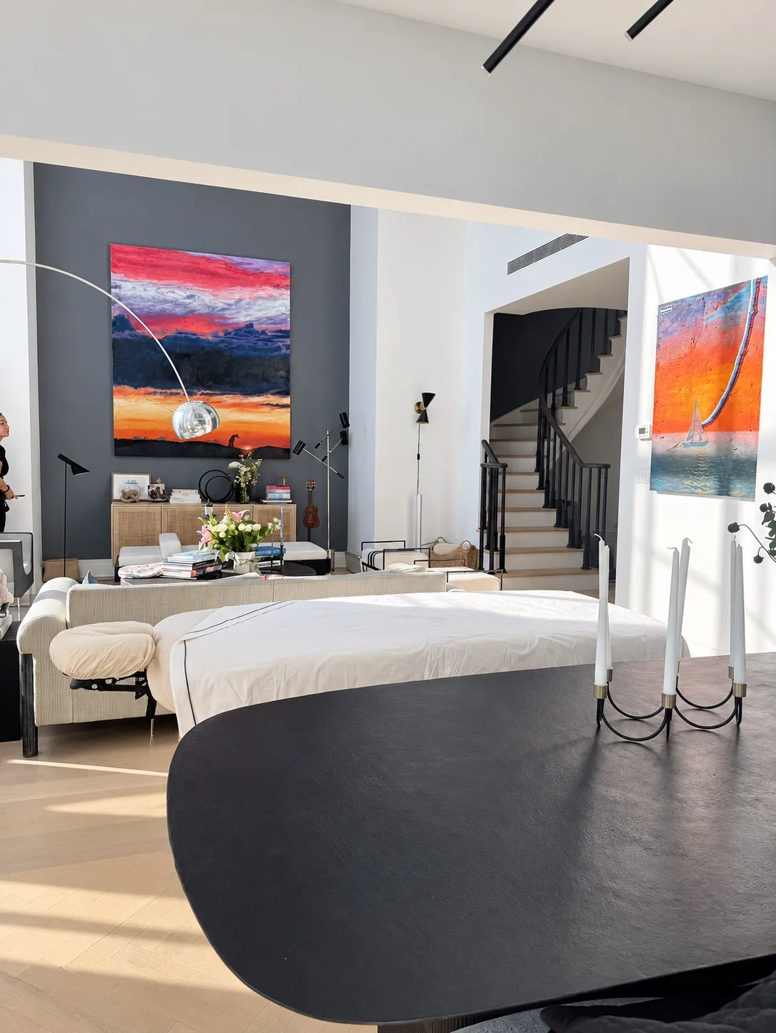 Knead NYC massage table set up in a private residence with original artwork and warm natural light